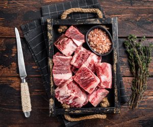 Uncooked,Raw,Diced,Cubes,Of,Lamb,Meat,In,Wooden,Tray